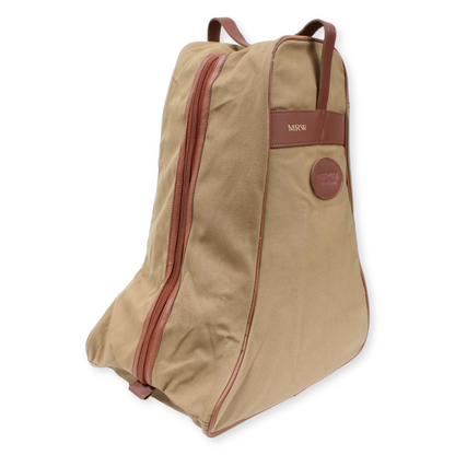 Beige boot bag with brown accents on a white background