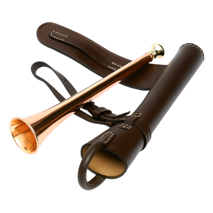 Bronze hunting horn with leather case on a white background