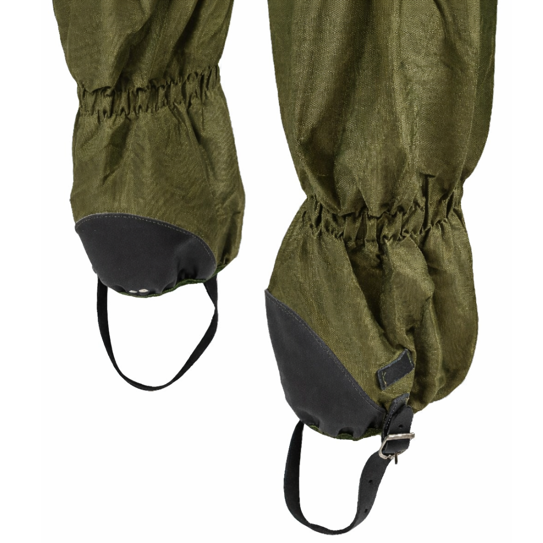 Green hiking gaiters with black straps on a white background