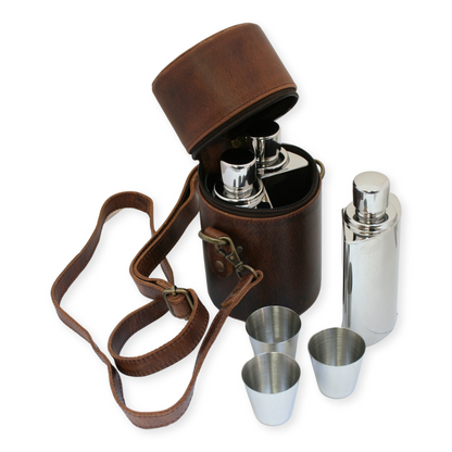 Brown leather flask set with silver flask and cups on a white background