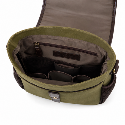 Inside of Green dog training bag with compartments on a white background