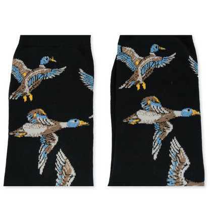 Black socks with duck pattern on a white background