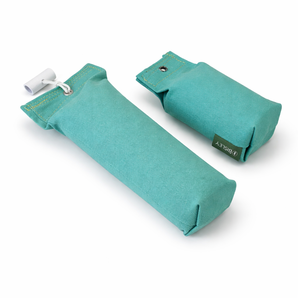 Two teal fabric dog dummies on a white background