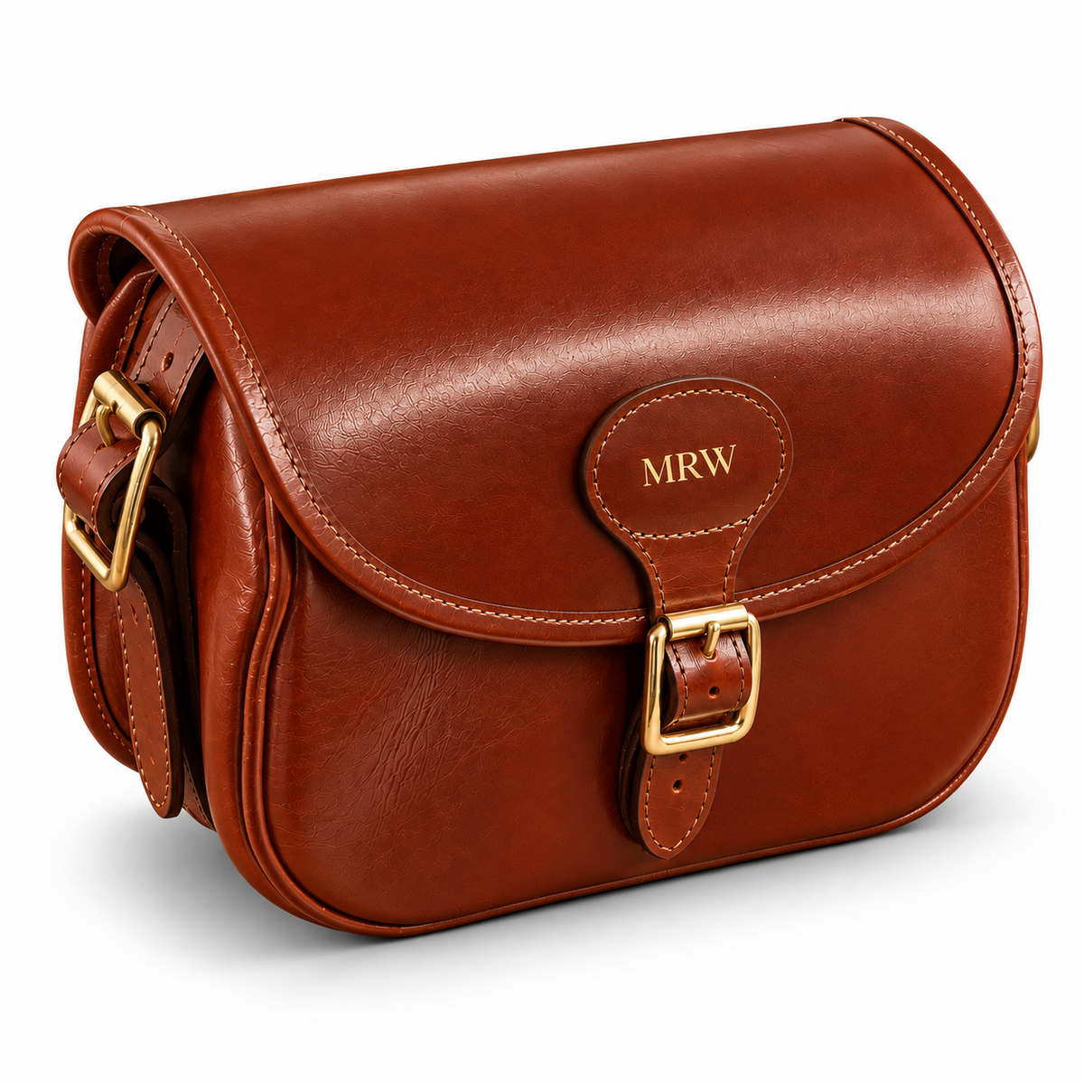 A brown leather cartridge bag with a flap closure, gold-tone buckle, and a personalized 'MRW' monogram on the leather tab, shown on a clean white background.