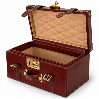 A vintage-style leather storage trunk with an open lid, featuring a quilted tan interior lining and gold-tone metal hardware, shown on a plain white background.
