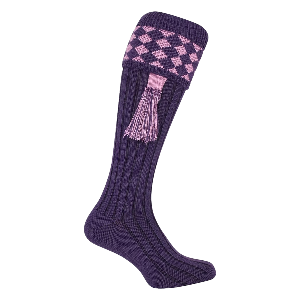 Purple knee-high sock with pink diamond pattern and tassel on a white background