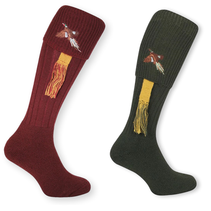 Two pairs of socks, one red and one green, with embroidered pheasantdesigns on a white background.