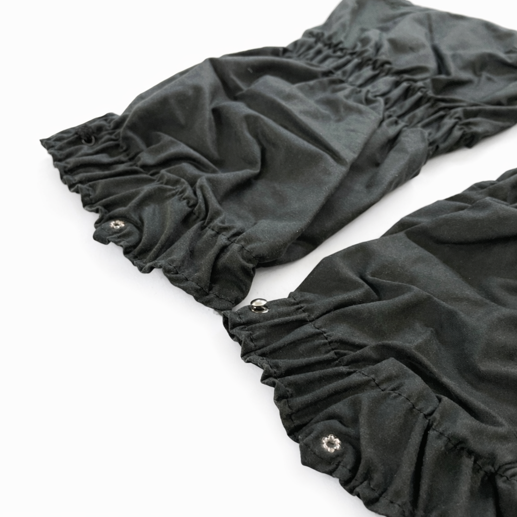 Dark  ruffled fabric wax gaiters on a white background