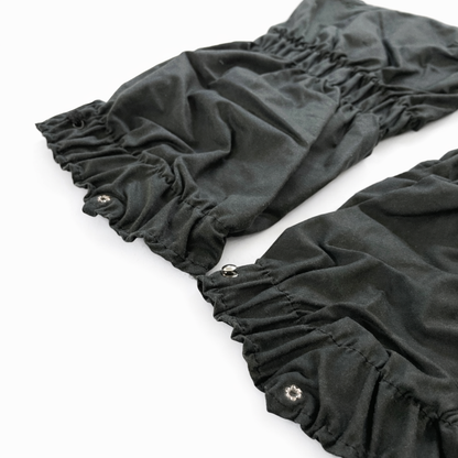 Dark  ruffled fabric wax gaiters on a white background