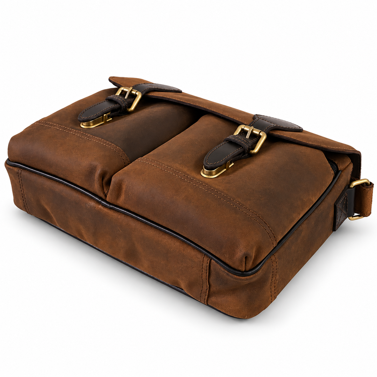 A brown leather messenger bag with two front flap pockets, gold-tone buckles, and a black shoulder strap, shown on a clean white background.