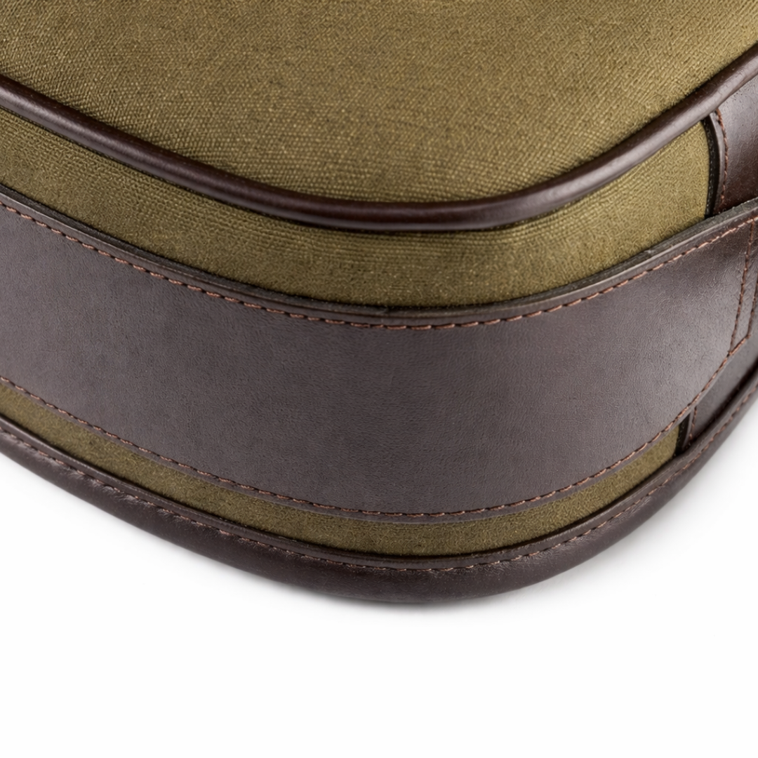 Canvas cartridge bag leather details close up on white