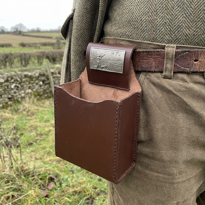 Leather cartridge Box holder with pewter shooting scene motif. attached to a shooters belt 