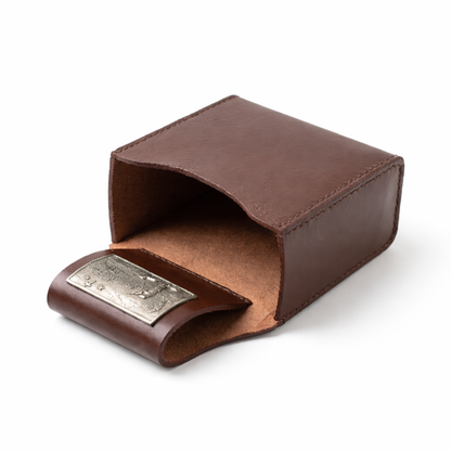 Leather cartridge Box holder lay down with pewter shooting scene motif. on white background