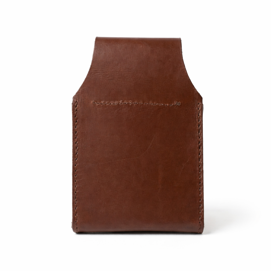 Back of a Leather cartridge Box holder with pewter shooting scene motif. on white background