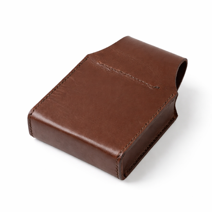 back and base of a leather cartridge Box holder with pewter shooting scene motif. on white background