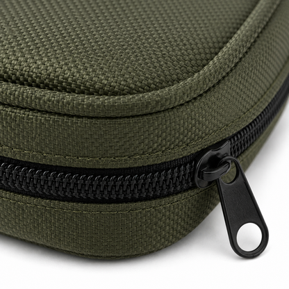 Close-up of an olive green woven fabric zippered rifle cleaning case with a black zipper and black pull tab on a white background.
