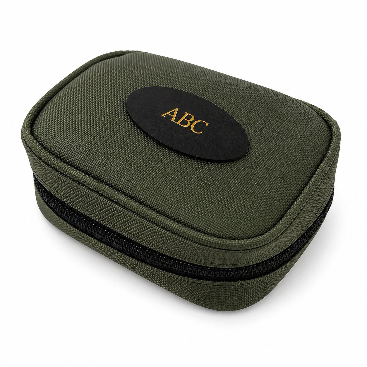 An olive green zippered fabric rifle cleaning case with a black oval patch on top featuring the gold embroidered letters 'ABC'.