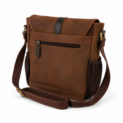 The back of a brown leather crossbody dog training bag on a white background