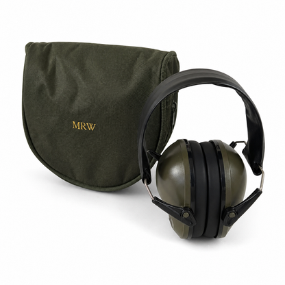 Green ear protection headphones with a carrying case on a white background