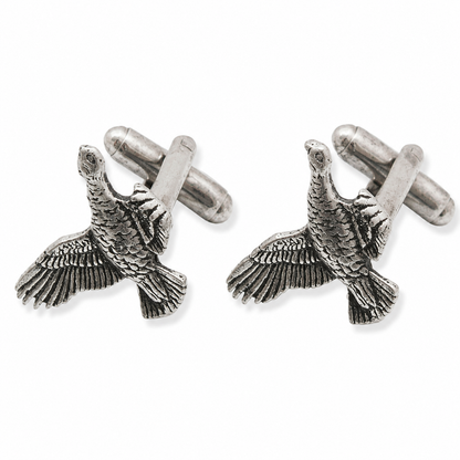 A pair of pewter cufflinks shaped like flying grouse with detailed feather textures, shown on a clean white background.