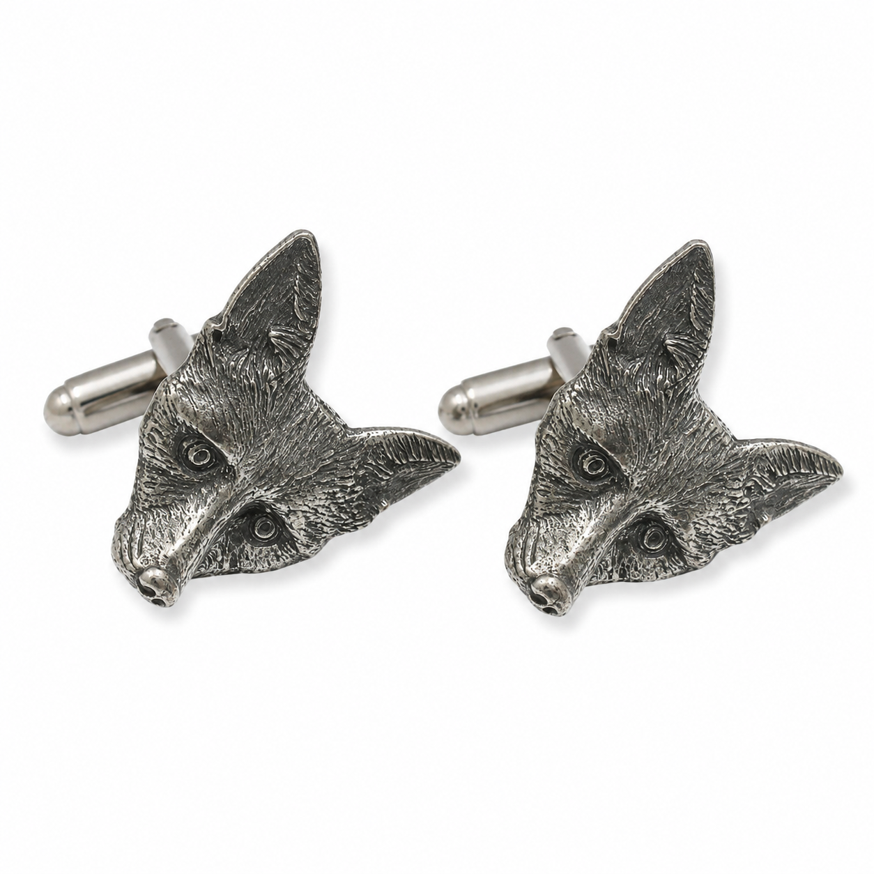A pair of pewter cufflinks shaped like fox heads, shown on a clean white background.