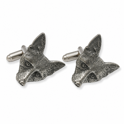 A pair of pewter cufflinks shaped like fox heads, shown on a clean white background.