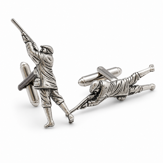Pewter cufflinks shaped like game shooters, photographed on a clean white background.