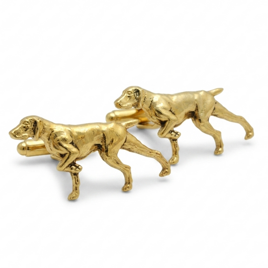 A pair of gold plated metal cufflinks shaped like pointers, shown on a clean white background.