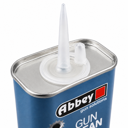 A closeup of the top of a blue tin of Abbey Gun & rifle Oil with a white cap, designed for cleaning shotguns and rifles.