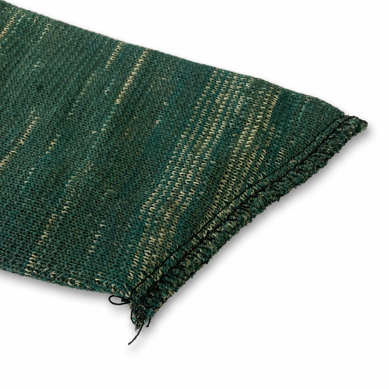 a closeup of the end of a green fabric gun slip sock