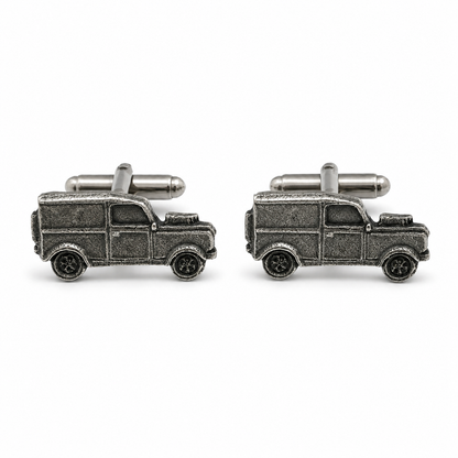 A pair of pewter cufflinks shaped like vintage 4x4s, shown on a clean white background.