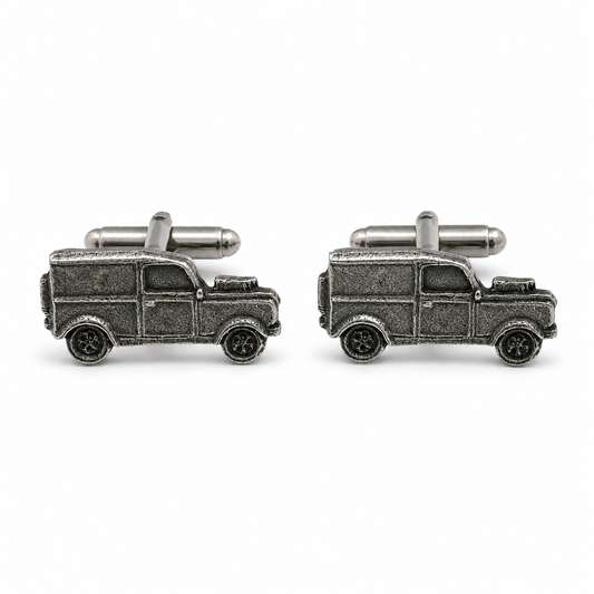 A pair of pewter cufflinks shaped like vintage 4x4s, shown on a clean white background.