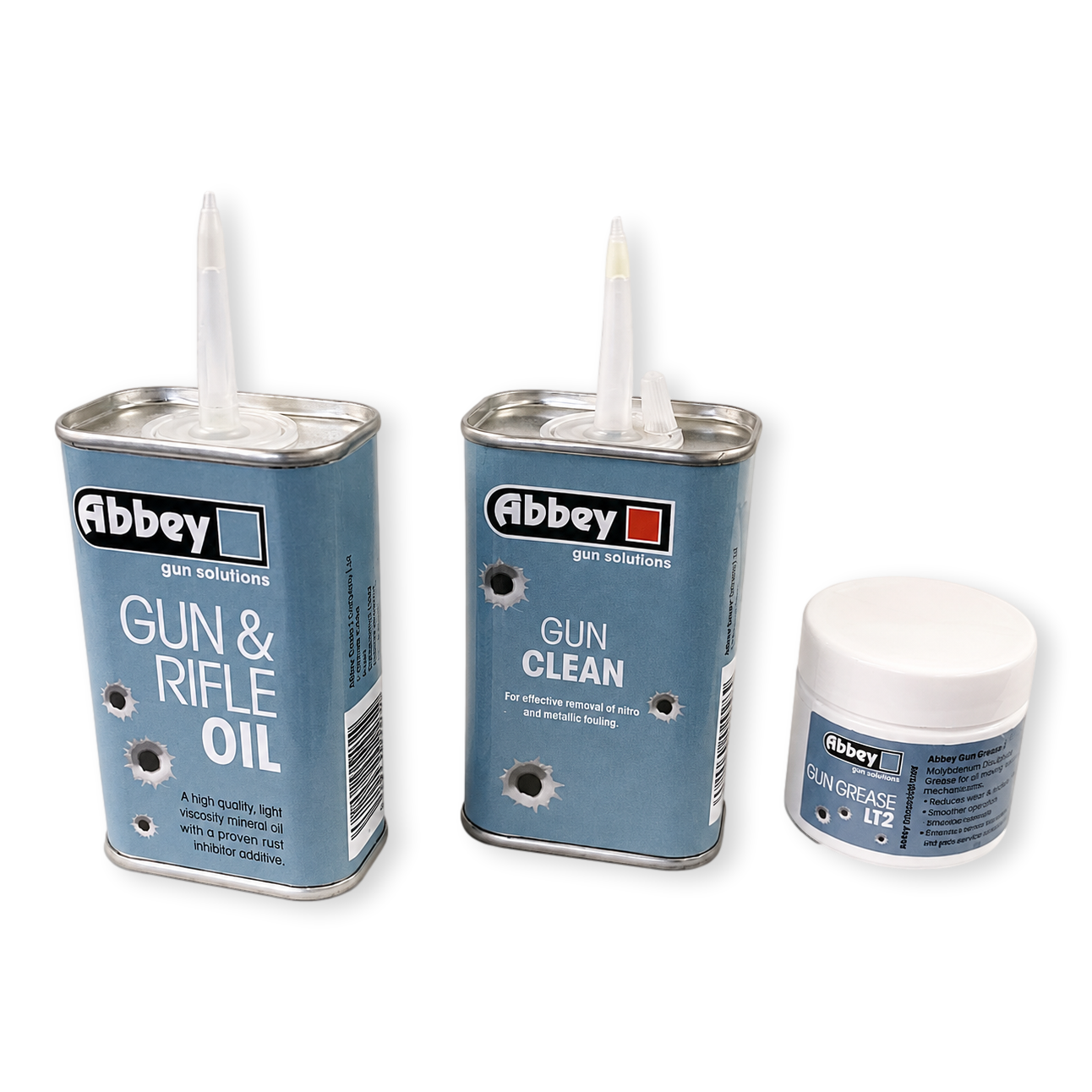 Three canisters of Abbey gun solutions products on a white background: Gun & Rifle Oil, Gun Clean, and Skin Grease No. 12.