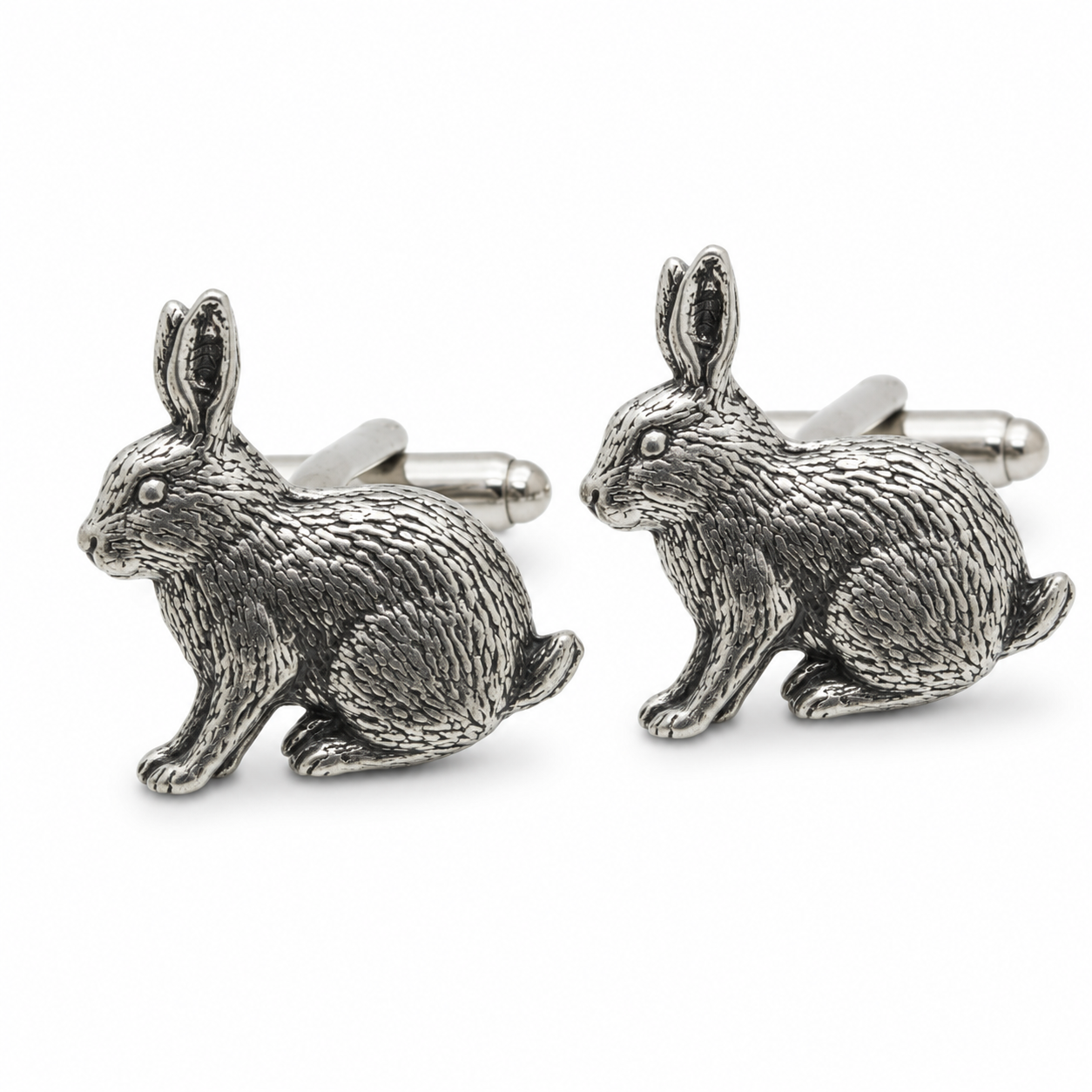A pair of pewter metal cufflinks shaped like sitting rabbits, shown on a clean white background.