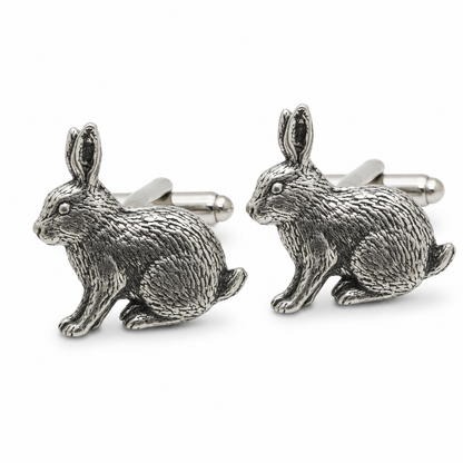 A pair of pewter metal cufflinks shaped like sitting rabbits, shown on a clean white background.
