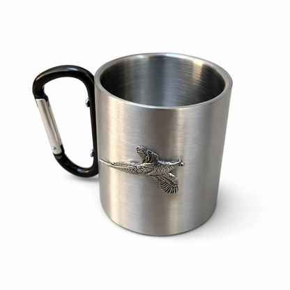 Stainless steel mug with black carabiner handle and pheasant emblem on a white background