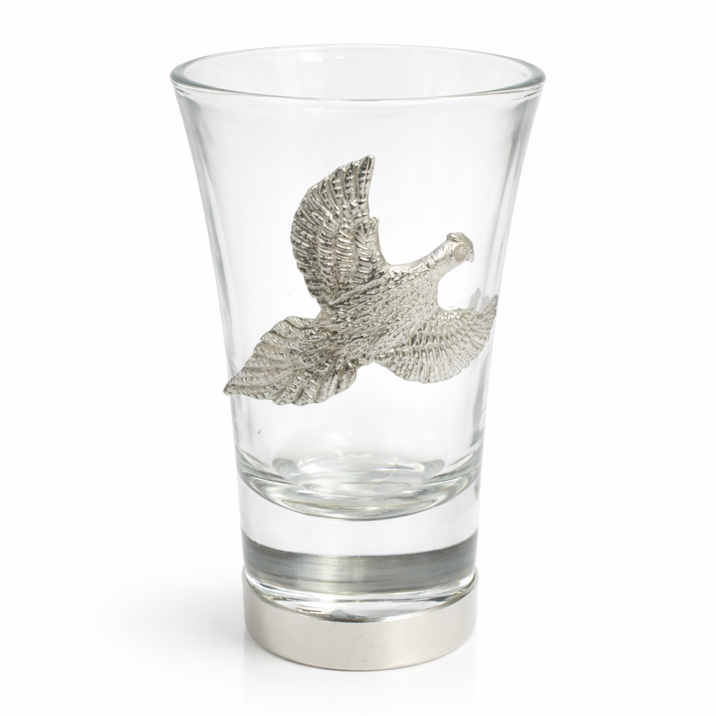 One pheasant shot glass standing up on white
