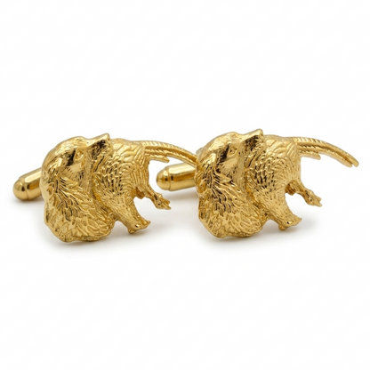 A pair of gold plated spaniel & Pheasant cufflinks with detailed textured fur, displayed on a clean white background.