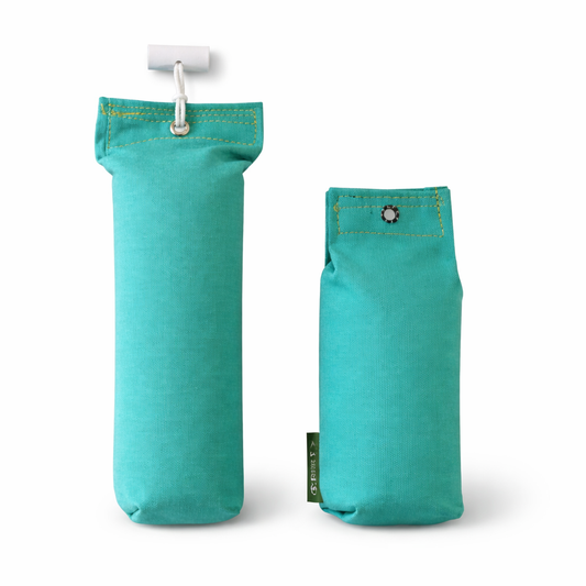 Two different sized teal fabric dog dummies on a white background